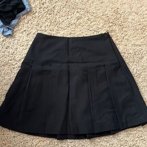 Black pleated mini skirt